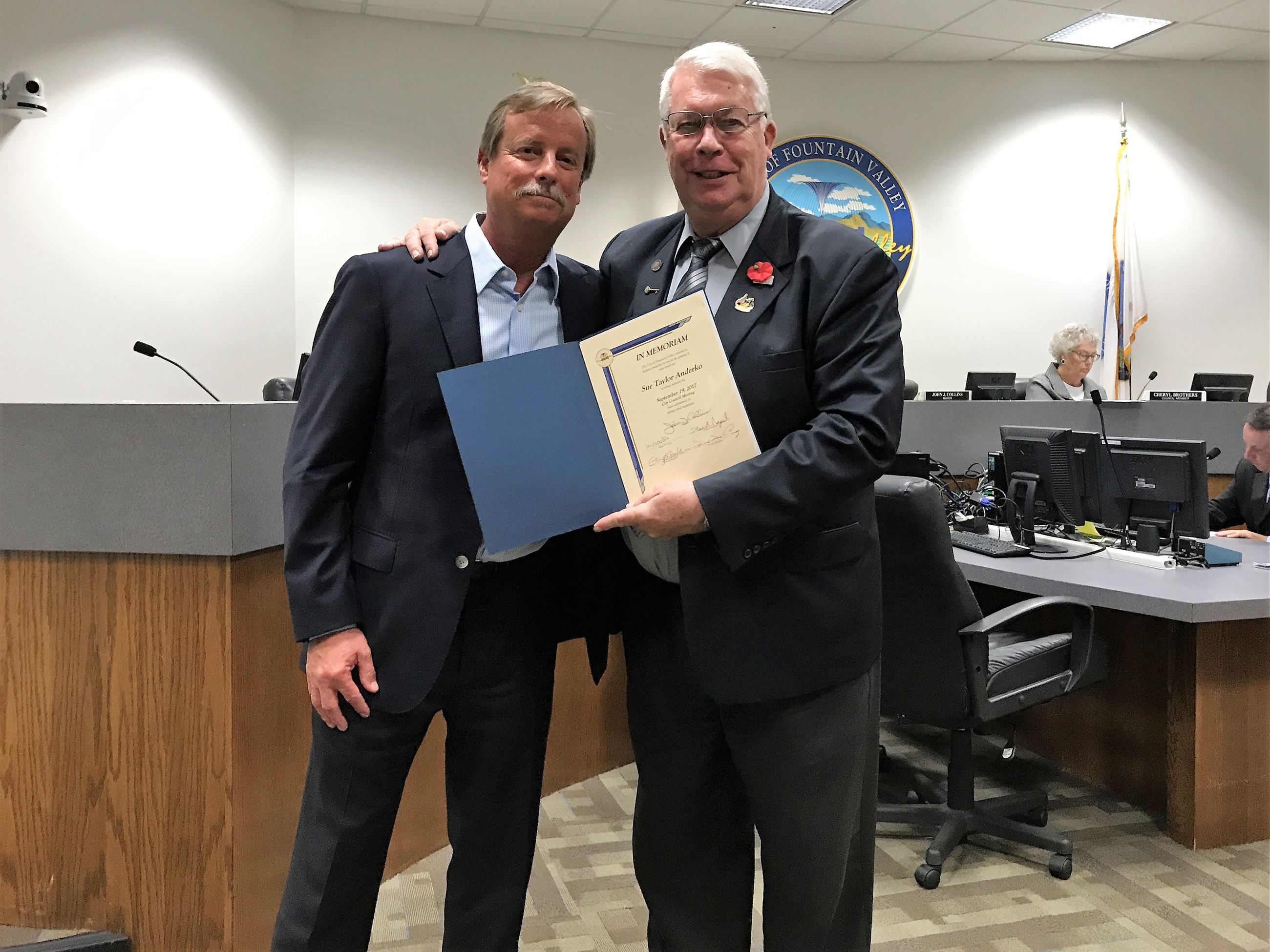 Husband Joe Anderko receives memoriam from Mayor John Collins