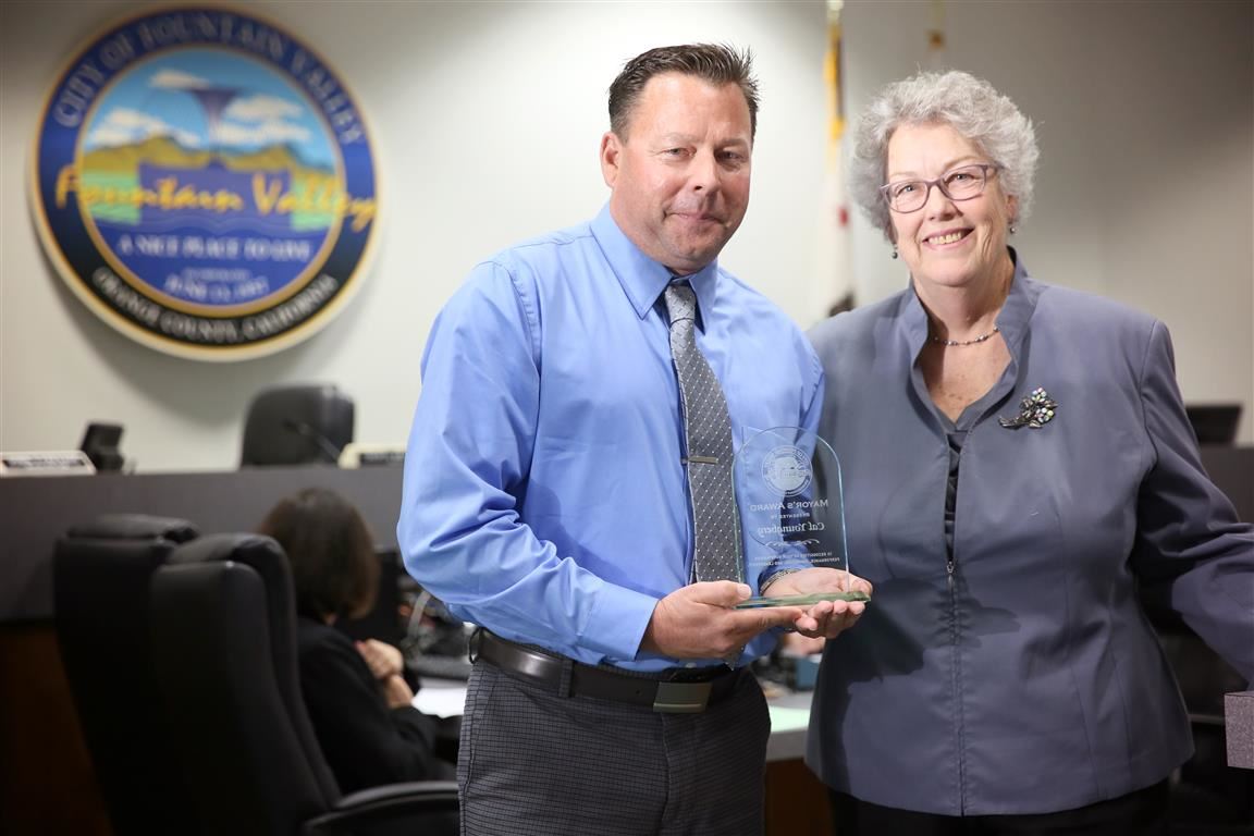 Cal Youngberg recieves the Mayor's Award from Mayor Cheryl Brothers